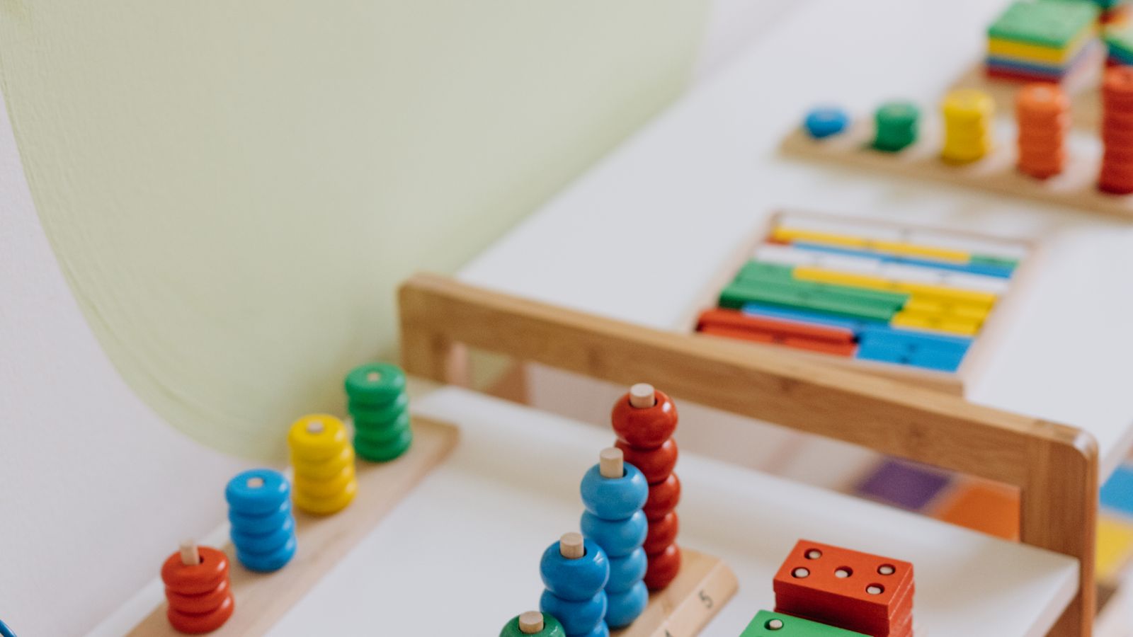 Colourful educational wooden toys and puzzles on a table — birthday gift ideas for toddlers UK