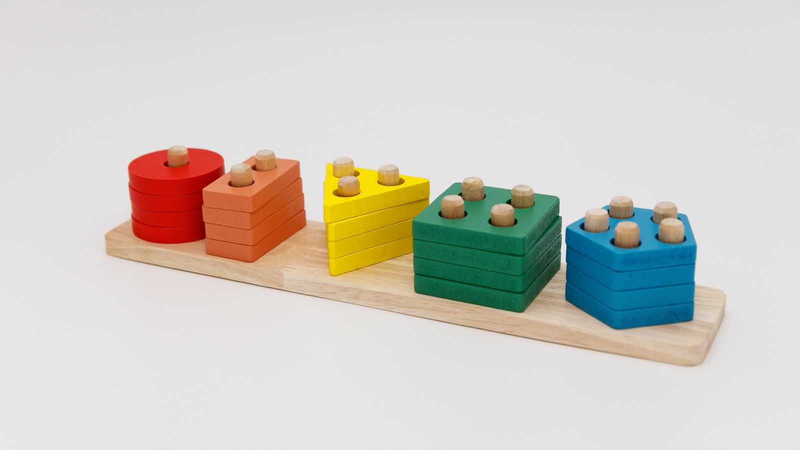 Wooden Montessori shape-stacking toy in red, orange, yellow, green and blue, birthday gifts for 2 year olds UK