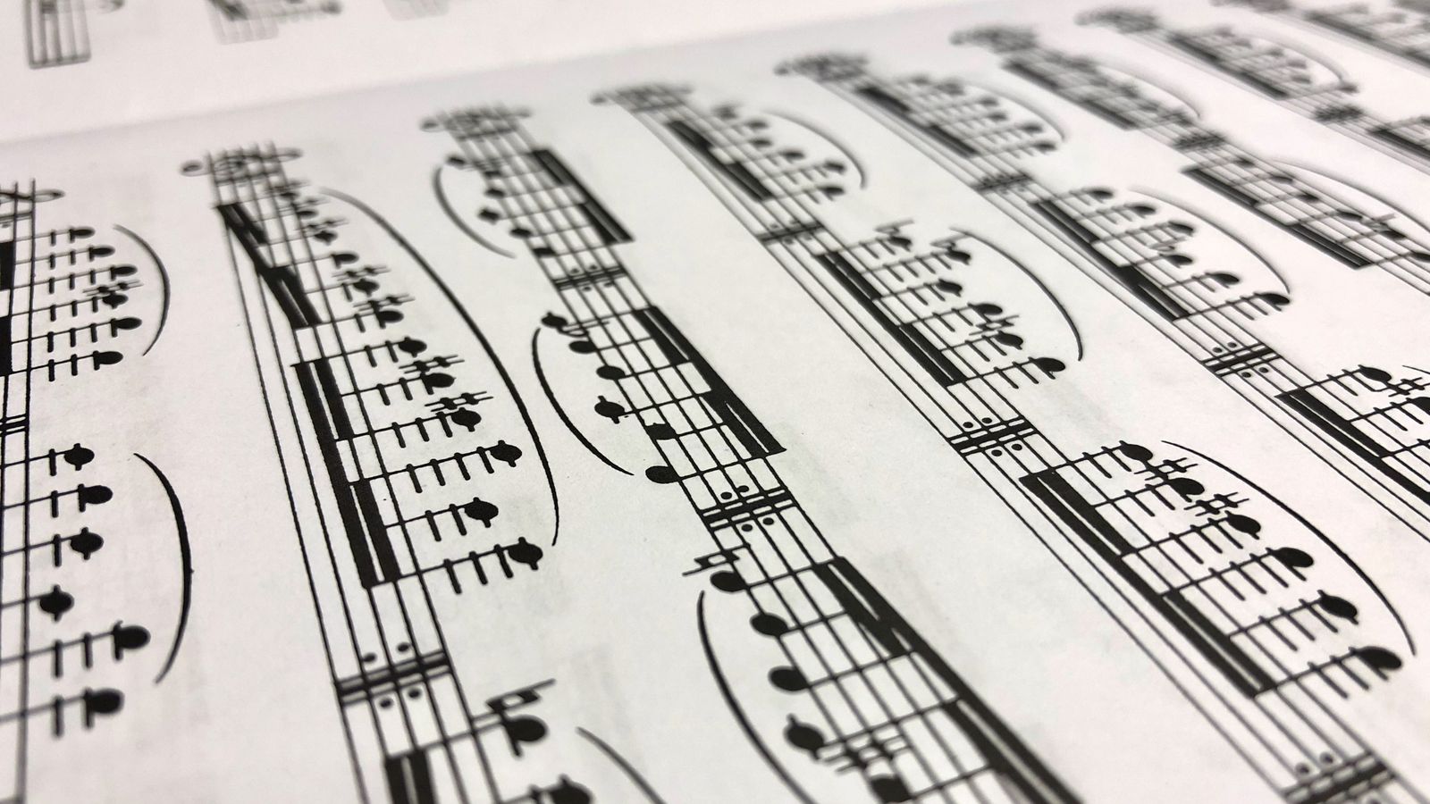 Close-up of musical notation on sheet music — the gift they'll watch a hundred times